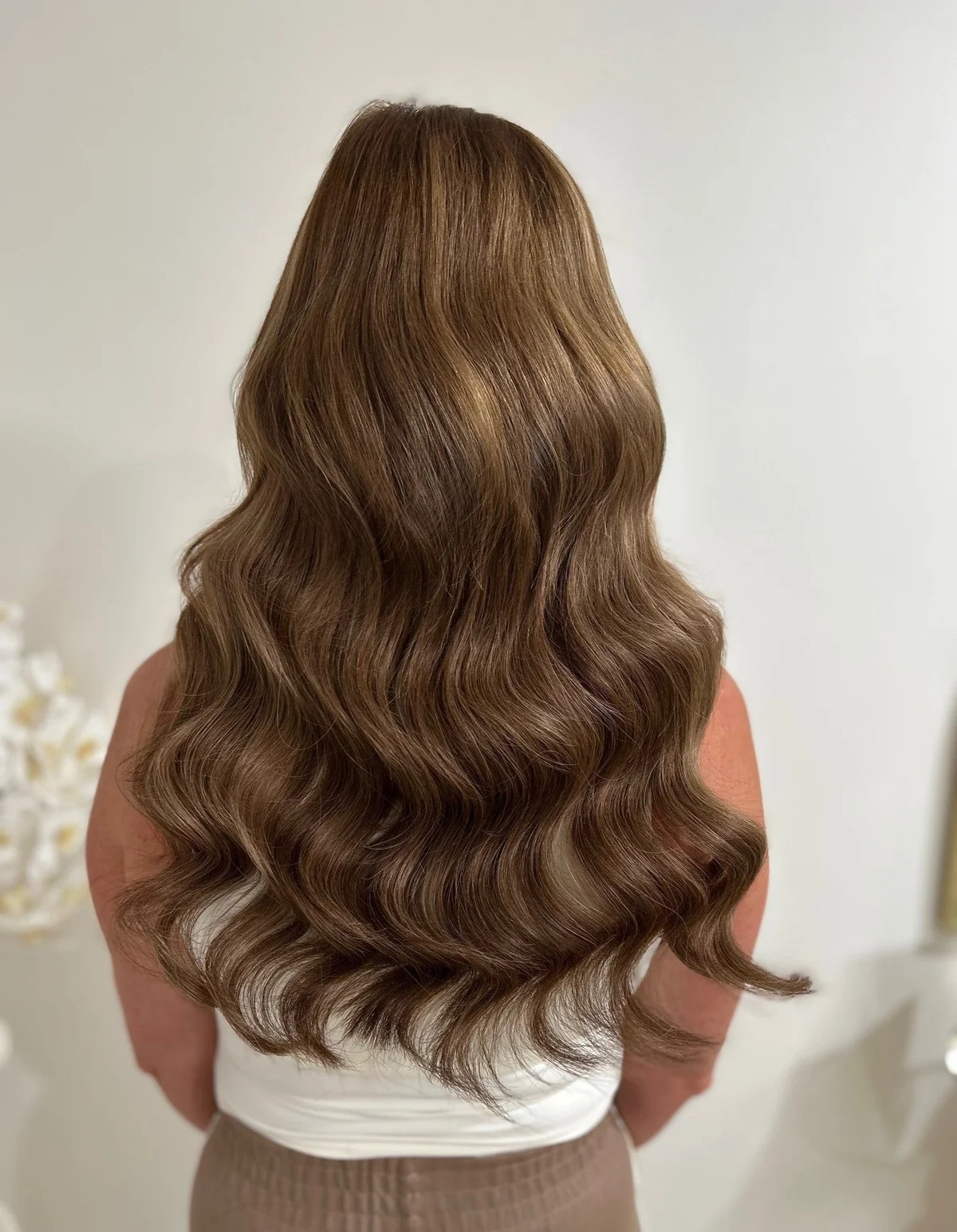20 inch invisible weft hair extensions on a mid-height client