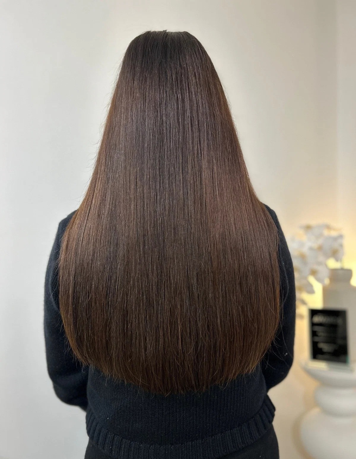 22 inch invisible weft hair extensions on a mid-height client
